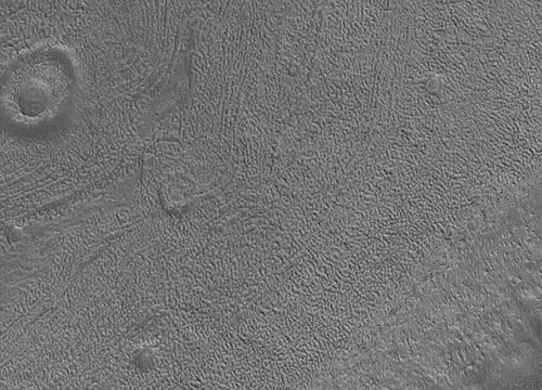 Close up image of Phaethontis surface taken by Mars Global Surveyor, under MOC Public Targeting Program. Pits are thought to be caused by buried ice turning into a gas.
