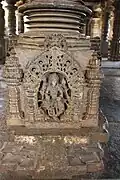 Pillar pedestal relief in the open hall in Kalleshvara temple at Bagali