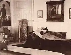 Interior of Villa Lysis, Nino Cesarini reclining under his own portrait painted by Paul Hoecer, Wilhelm von Plüschow