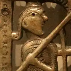 Figure presumed to be Longinus on the Clonmacnoise Crucifixion Plaque, c. 1090–1110