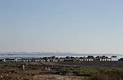 Khniss is a small city in the Tunisian Sahel region. It is located on the coast, 5 km south of Monastir. Its population is estimated at around 11,000 as of 2014.