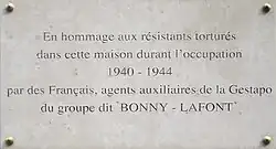 Commemorative plaque with the inscription "In hommage to Resistance members tortured in this house during the occupation 1940-1944, by French agents of the Gestapo from the group known as "Bonny-Lafont"