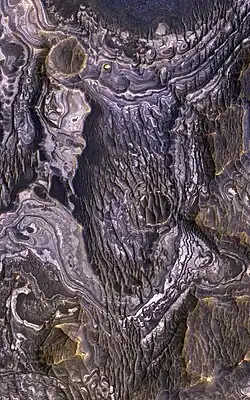 Plateau near Juventae Chasma. Ferric hydroxysulfate (Fe3+SO4OH) has been found here.[12][13]