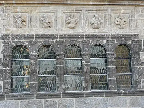 The five windows with frieze above.