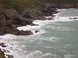 rocks jutting out into the sea.