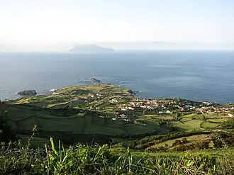 View of Ponta Delgada das Flores, with the distant island of Corvo