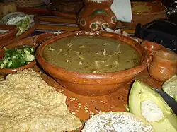Green pozole, with condiments, served in Zihuatanejo (Guerrero)