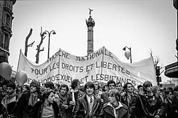 Marchers with banner: 'Marche nationale pour les droits et les libertés des homosexuels et des lesbiennes'