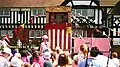 A Punch and Judy show on the village green