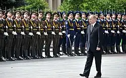 Russian President Vladimir Putin passing in front of the guard on Victory Square