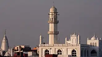 The Minaret-ul-Masih of Aqsa Mosque is one of the major landmarks of Qadian. (A Mandir and a Gurudwara can be seen in the background)