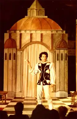 A photograph of Tom Hanks on the stage performing as Callimaco in the play, The Mandrake, at The Riverside Shakespeare Theatre