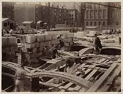 Rafael Guastavino inspecting recently laid tile arch along Boylston Street
