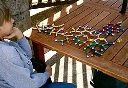 A boy with Asperger's playing with magnetic toys.