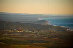 An aerial photograph of Ross, with the Tasman Sea seen to the right