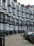 Houses on Royal Crescent, Brighton are entirely faced with black mathematical tiles Location on Google Maps