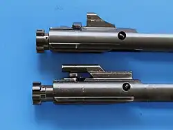 AR-15 bolt carriers showing multiple locking lugs on the bolts