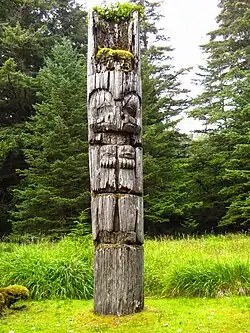 A Canadian totem pole from the Haida Village Site, carved with a face