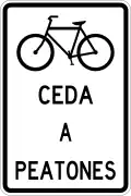R-11-18 Bicycles yield to pedestrians