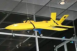 A yellow model plane suspended from the ceiling.