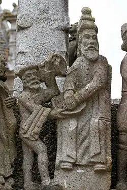 Pontius Pilate turns to wash his hands in a bowl of water held by his servant. He looks across at Jesus being led away by two soldiers