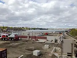 A construction site with low concrete walls in place