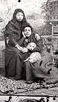 Two Coast Salish women with a dog suspected to be a mixed woolly dog. (Chilliwack Museum and Archives), before 1900