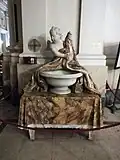 Holy water font made from polychrome marble
