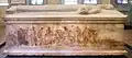 View of a long side of the sarcophagus with the painting of either Alexander or the Greeks defeated in battle.