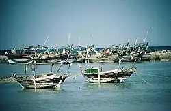 A diver swimming through a sunken ship.