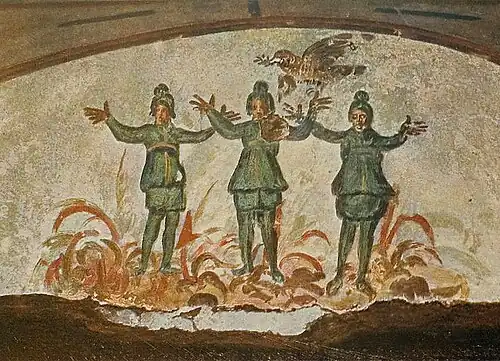 Wall painting from the early Christian Catacomb of Priscilla in Rome, 3rd/4th century AD, showing three figures in a fire above whom flies a dove with a branch in its beak