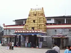 Sringeri Sharadamba temple with red and white banded frieze and a gilded multi-tier entrance.