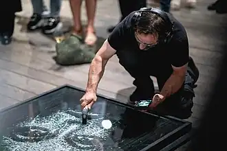 Simon Berger producing a new artwork in a live performance at Aurum Gallery, Bangkok