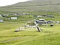 The church in Skálavík and a part of the village.