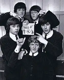The members of Swedish pop band Tages pose with a vinyl single copy of their debut single "Sleep Little Girl", released in 1964.