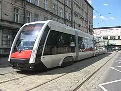 Red and white five-section tram