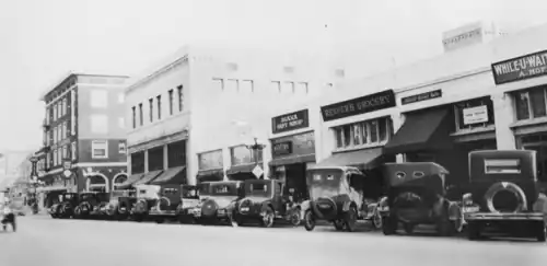 South side of the 200 block of West Center Street, Anaheim, California, c.1924–1926, Valencia Hotel, intersection of Lemon Street, and S.Q.R. department store at left