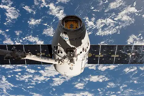 Dragon grappled by the ISS