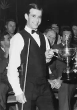 A head and shoulders portrait of John Spencer