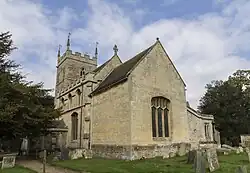 A stone church with a Gothic tower