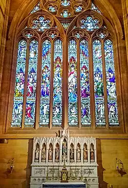 Chapel of Our Lady with stained glass windows above, the reredos features statues of influential female saints