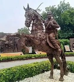 Statue of the Rani of Jhansi armed with a sword astride a rearing horse