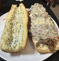 Steak sandwich with provolone cheese and garlic aioli