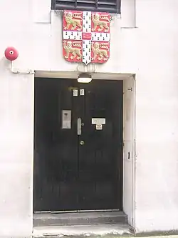 The university's arms above the back door to Bentley House, formerly the University Press's London office