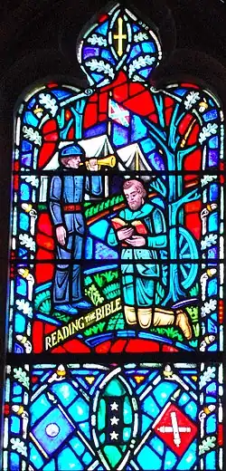Jackson reading the Bible in a Confederate camp in a stained glass window of the Washington National Cathedral. The windows were removed in 2017.[98]