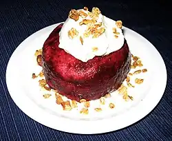 Pan de Mie soaked with raspberries and blackberries. Topped with whipped cream mixed with creme fraiche and buttermilk and garnished with granola.