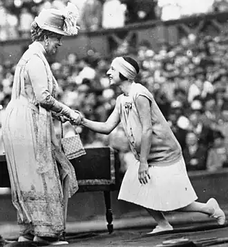 French tennis player Suzanne Lenglen shaking hands with Queen Mary at the Auteuil Hippodrome in Paris in 1926.