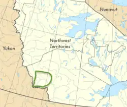 Symphyotrichum nahanniense general range within Northwest Territories, Canada. The species has been found at seven hot springs locations within the Nahanni National Park Reserve. The general location of those hot springs is outlined in green on the map.