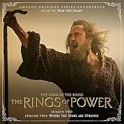 Album cover featuring a screenshot from the episode, depicting a bearded man in a brown robe holding a staff.