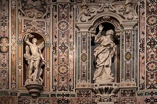 Niches with the statues of saint Sebastian and saint Irene.